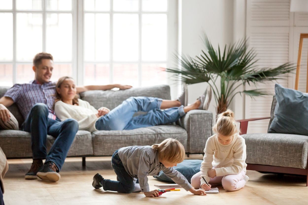 family hanging out inside of a living room