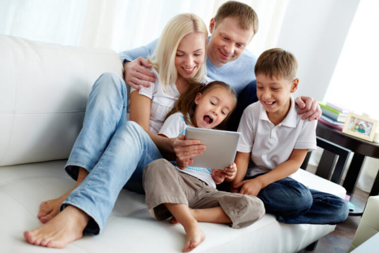family looking at device