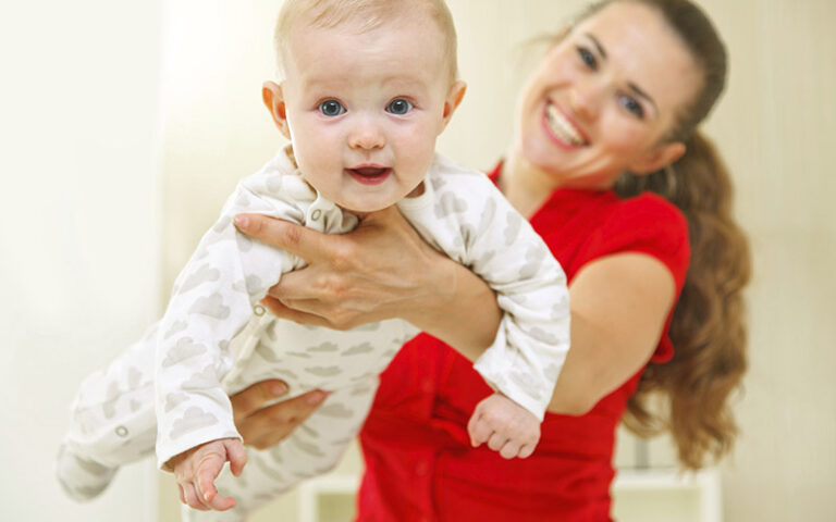 mother holding baby
