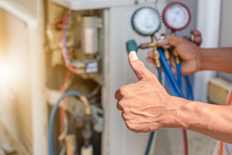 technician measureing refrigerant