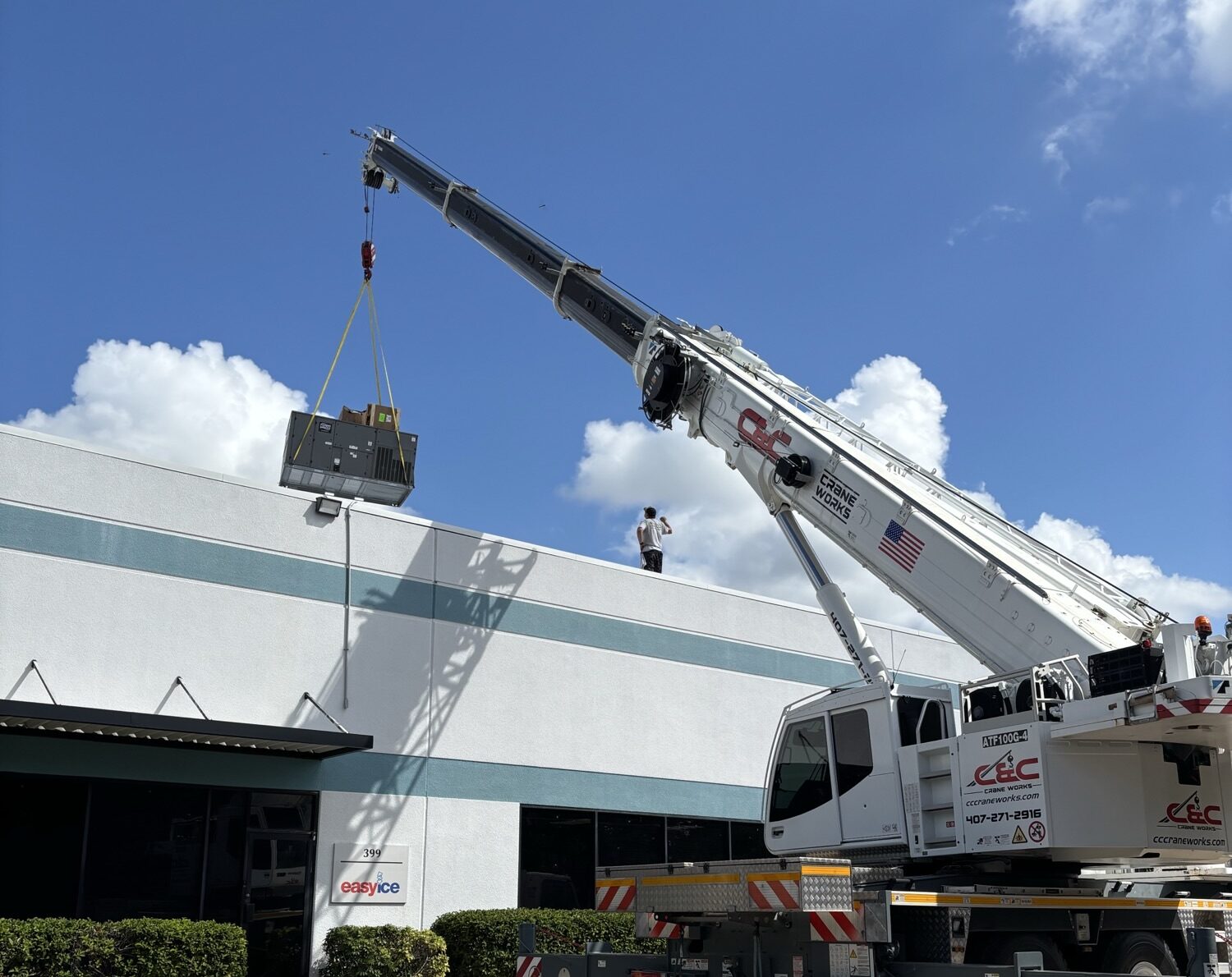 Crane lifting ac unit onto roof ac install - Crane lifting ac unit onto roof